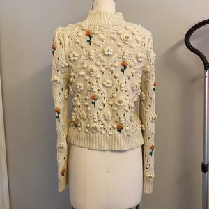 Zara knit sweater with flower detail and high collar. Gathered at the shoulder